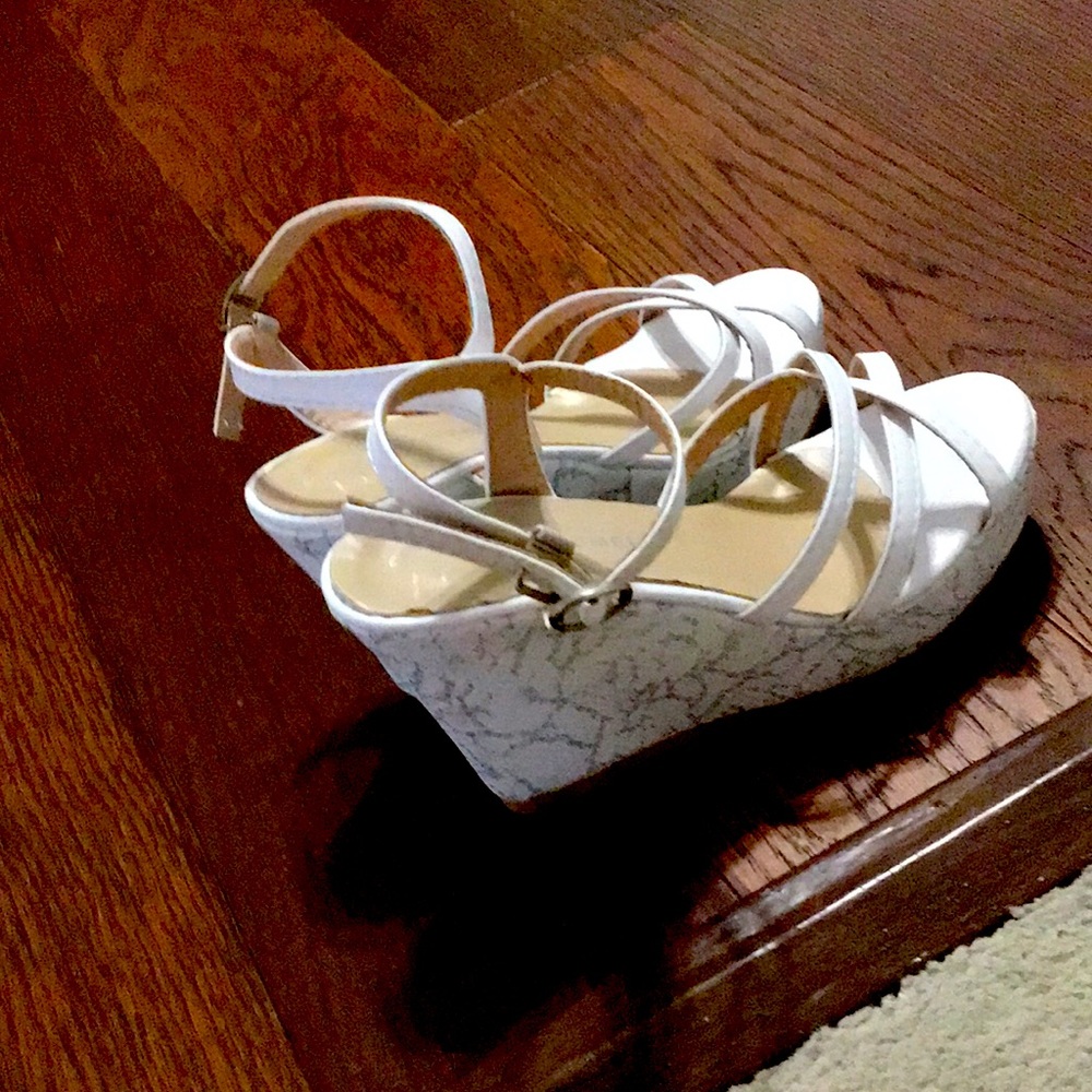 They are white wedges with a strap in ankle